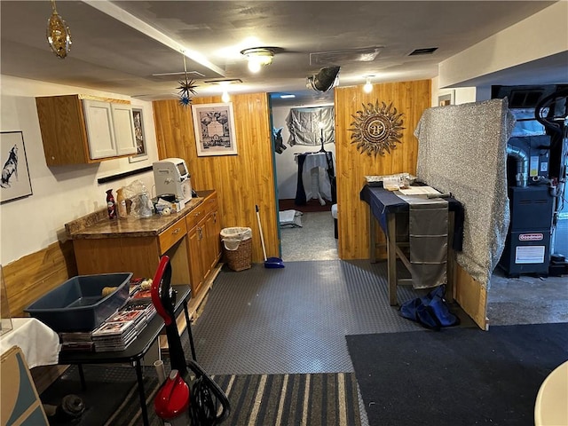 171 Vinal Ave, Irondequoit, NY 14609 - kitchen featuring wooden walls and brown cabinetry