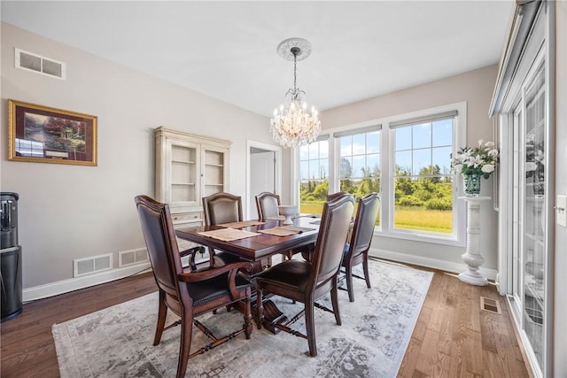905 Pathway Ln, Webster, NY 14580 - dining area with a chandelier and wood finished floors
