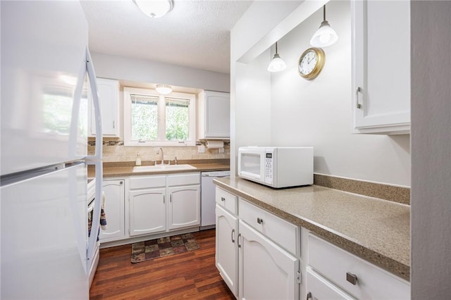 321 Penhurst Rd, Brighton, NY 14610 - kitchen with white appliances, white cabinetry, dark wood-style floors, and a textured ceiling