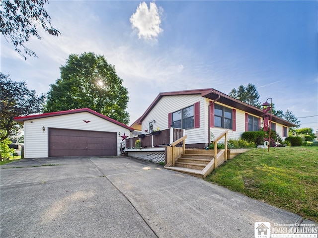 407 N Clark St, Olean, NY 14760 - view of front of property featuring an outbuilding, a detached garage, and a front yard