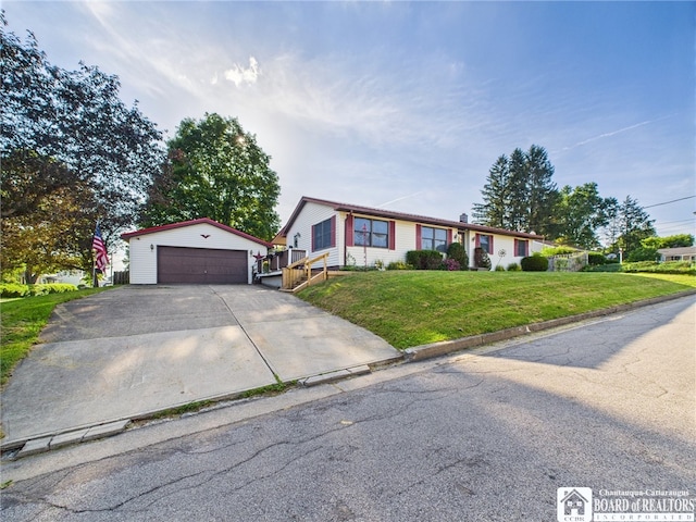 407 N Clark St, Olean, NY 14760 - ranch-style house featuring an outdoor structure, a garage, and a front yard