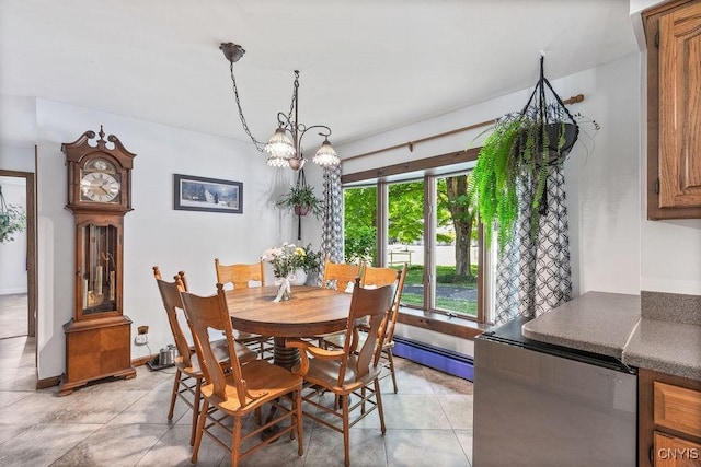 20 Hickory Grove Rd, Spur, Minetto, NY 13069 - dining space with light tile patterned floors, a baseboard radiator, and a chandelier
