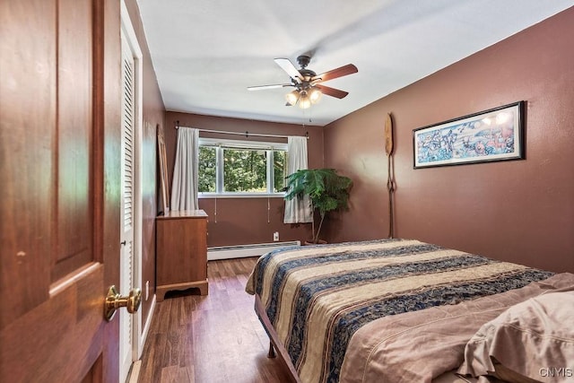 20 Hickory Grove Rd, Spur, Minetto, NY 13069 - bedroom with a baseboard radiator, wood finished floors, and ceiling fan