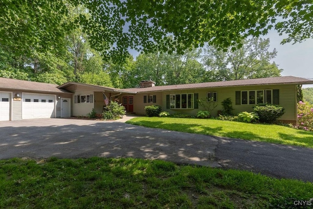 20 Hickory Grove Rd, Spur, Minetto, NY 13069 - ranch-style house with asphalt driveway, an attached garage, a chimney, and a front lawn