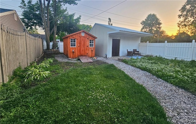 218 Edward St, North Tonawanda, NY 14120 - fenced backyard featuring a storage unit
