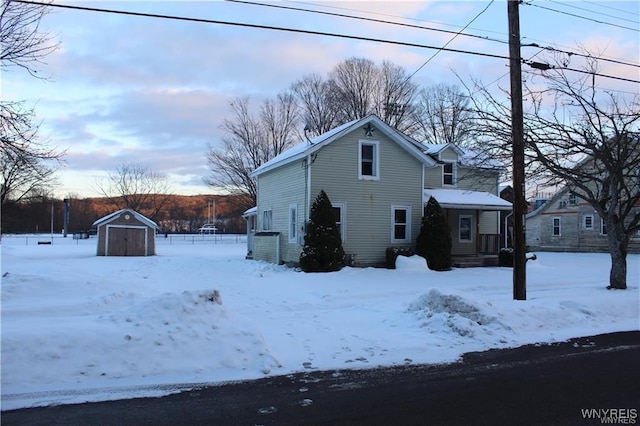 61 N Franklin St, New Albion, NY 14719 - snow covered property featuring a storage shed