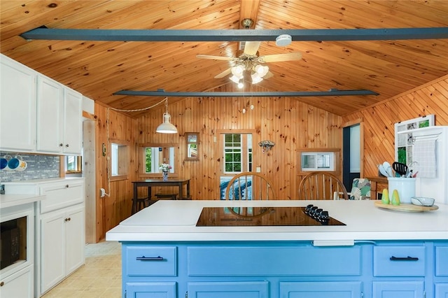 1753 Log Cabin Rd, Torrey, NY 14527 - kitchen featuring black electric stovetop, light countertops, wood walls, decorative backsplash, and wooden ceiling