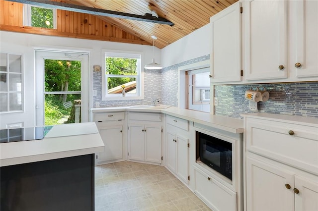 1753 Log Cabin Rd, Torrey, NY 14527 - kitchen with black appliances, lofted ceiling, wood ceiling, light countertops, and backsplash