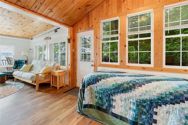 1753 Log Cabin Rd, Torrey, NY 14527 - bedroom featuring lofted ceiling, light wood-style floors, wood ceiling, and wooden walls