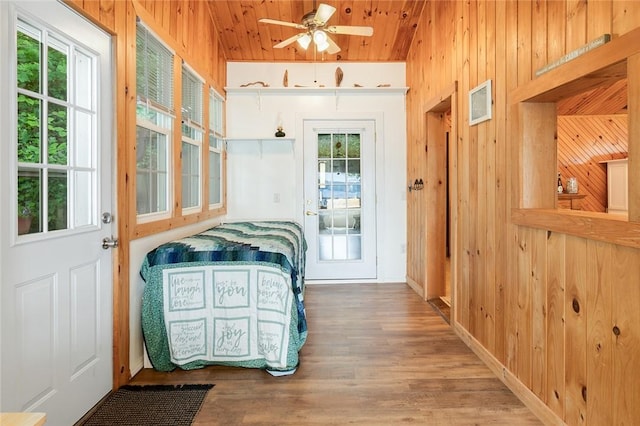 1753 Log Cabin Rd, Torrey, NY 14527 - doorway featuring wooden walls, plenty of natural light, wood finished floors, ceiling fan, and wood ceiling