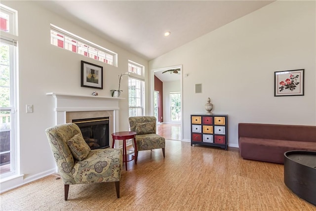 801 Surrey Hill Way, Henrietta, NY 14623 - living area with plenty of natural light, a high end fireplace, high vaulted ceiling, wood finished floors, and recessed lighting