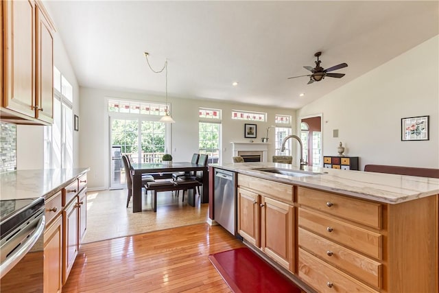 801 Surrey Hill Way, Henrietta, NY 14623 - kitchen featuring stainless steel appliances, a fireplace, ceiling fan, light wood-style flooring, and light stone countertops