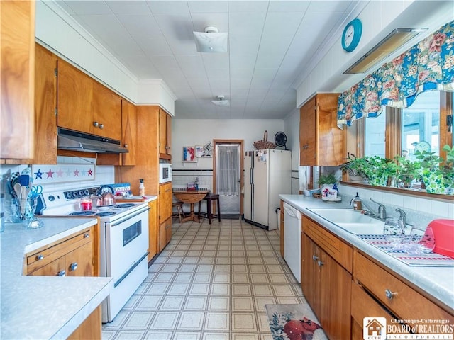12 Central Ave, Portland, NY 14716 - kitchen with white appliances, under cabinet range hood, light countertops, light floors, and brown cabinetry