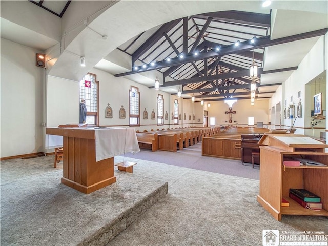 12 Central Ave, Portland, NY 14716 - kitchen with light carpet, a kitchen island, vaulted ceiling, brown cabinets, and open floor plan