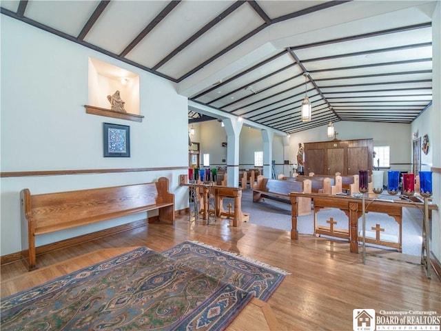 12 Central Ave, Portland, NY 14716 - living area with lofted ceiling, wood finished floors, and arched walkways