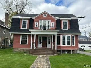 105 W.Garden, Wgarden, NY 13440 - view of front of house with a porch, a front lawn, and a balcony