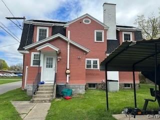 105 W.Garden, Wgarden, NY 13440 - back of property featuring a yard, a chimney, and entry steps