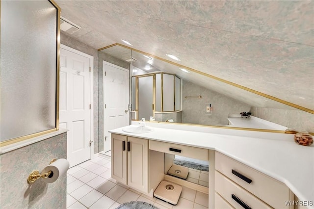 9555 The Maples, Clarence, NY 14031 - full bath featuring a shower stall, lofted ceiling, vanity, and tile patterned floors