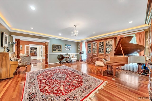 9555 The Maples, Clarence, NY 14031 - sitting room featuring ornamental molding, a chandelier, wood finished floors, recessed lighting, and french doors