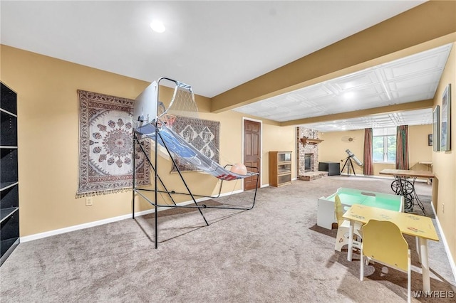 9555 The Maples, Clarence, NY 14031 - playroom featuring carpet floors and a fireplace