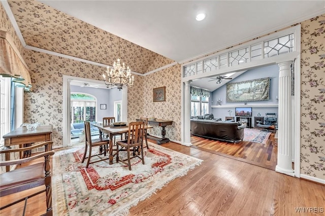 9555 The Maples, Clarence, NY 14031 - dining room featuring ornate columns, wallpapered walls, lofted ceiling, wood finished floors, and healthy amount of natural light