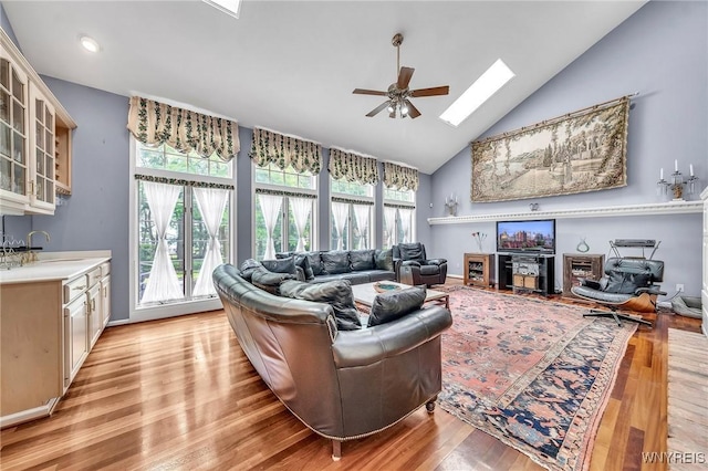 9555 The Maples, Clarence, NY 14031 - living room with a skylight, high vaulted ceiling, ceiling fan, light wood finished floors, and recessed lighting