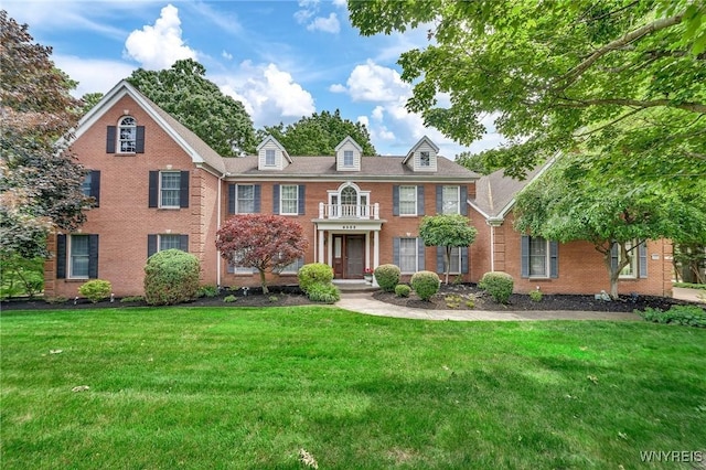 9555 The Maples, Clarence, NY 14031 - colonial inspired home with brick siding and a front yard