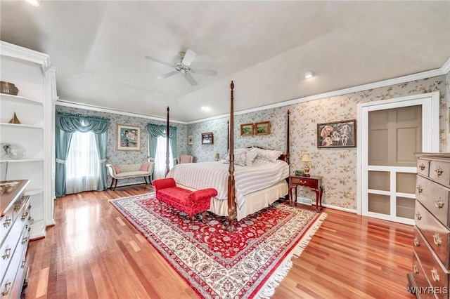 9555 The Maples, Clarence, NY 14031 - bedroom with wallpapered walls, light wood-style flooring, crown molding, and lofted ceiling