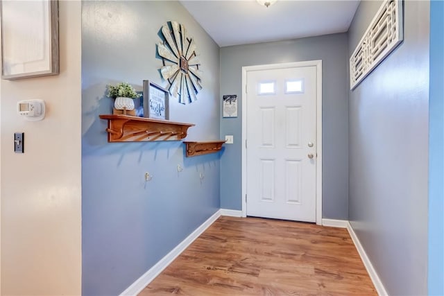 85 Campfire Rd N, Henrietta, NY 14467 - doorway featuring wood finished floors and baseboards