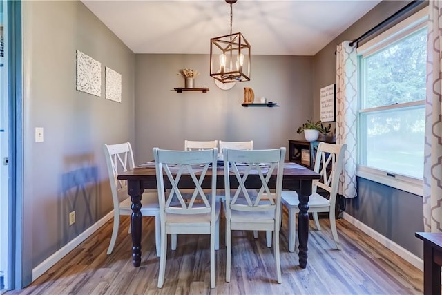 85 Campfire Rd N, Henrietta, NY 14467 - dining space with wood finished floors and a chandelier