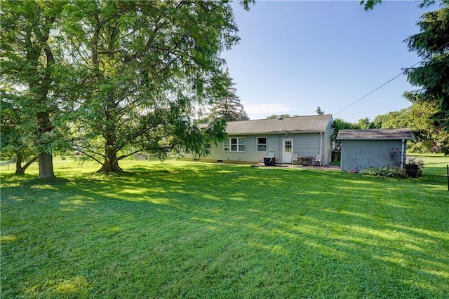 85 Campfire Rd N, Henrietta, NY 14467 - view of grassy yard with a patio area