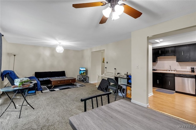 335 S Cayuga Rd Unit B, Amherst, NY 14221 - living room with a ceiling fan and a chandelier