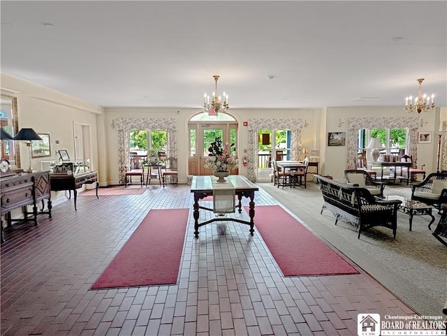 1 Pratt Ave Unit 302, Chautauqua, NY 14722 - living area with a chandelier and brick flooring