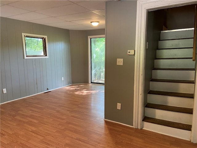 163 N Main St, Hornell, NY 14843 - staircase with healthy amount of natural light, wood finished floors, and wooden walls