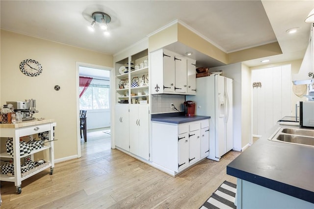 28 Crossfield Rd, Perinton, NY 14450 - kitchen featuring dark countertops, backsplash, white cabinetry, open shelves, and light wood-style flooring