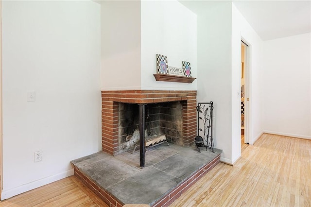28 Crossfield Rd, Perinton, NY 14450 - detailed view of wood finished floors and a fireplace