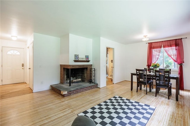 28 Crossfield Rd, Perinton, NY 14450 - living area featuring wood finished floors and a brick fireplace