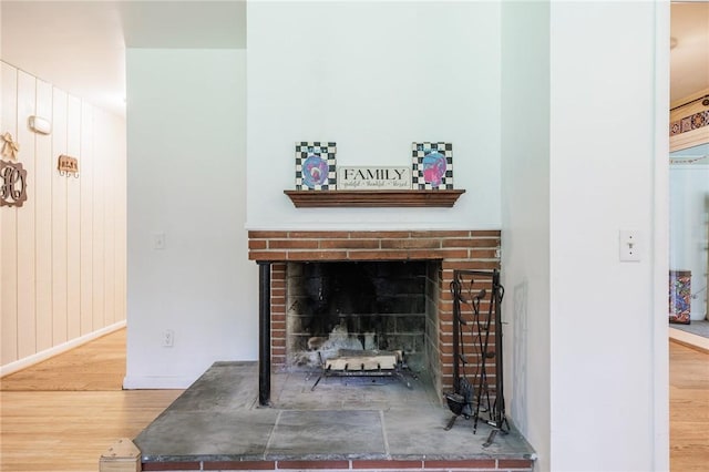 28 Crossfield Rd, Perinton, NY 14450 - detailed view of wood finished floors and a fireplace
