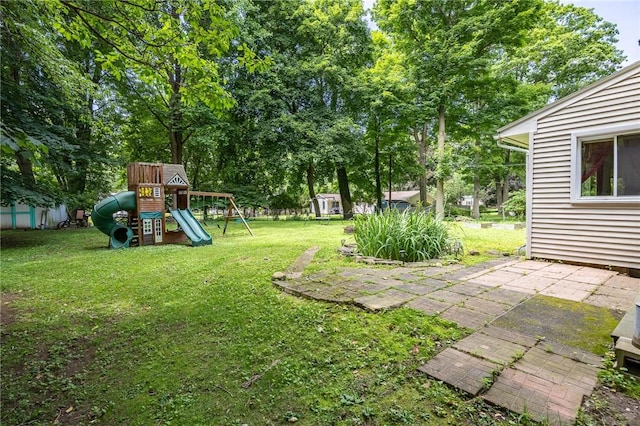 28 Crossfield Rd, Perinton, NY 14450 - view of grassy yard with a playground and a patio area