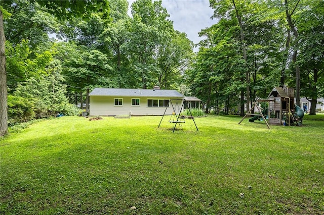 28 Crossfield Rd, Perinton, NY 14450 - view of grassy yard with a playground