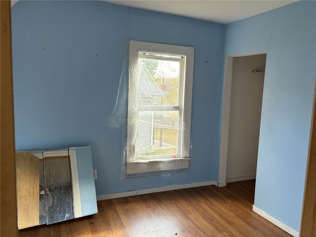 107 E Main St, Hornell, NY 14843 - empty room featuring wood finished floors and baseboards