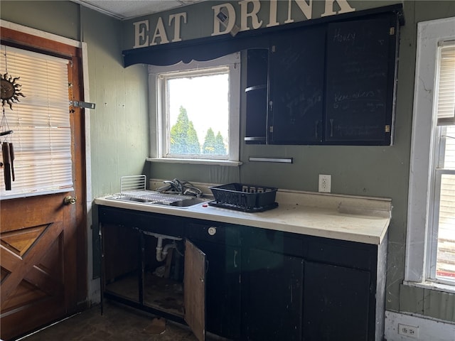 107 E Main St, Hornell, NY 14843 - kitchen with light countertops and blue cabinetry