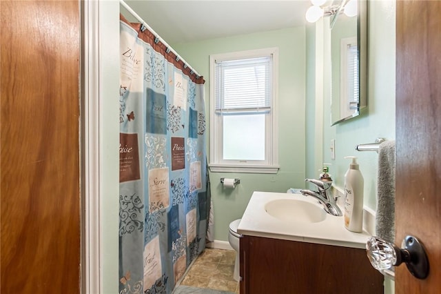 264 Harvest Dr, Greece, NY 14626 - bathroom with vanity, a shower with shower curtain, and stone finish floors
