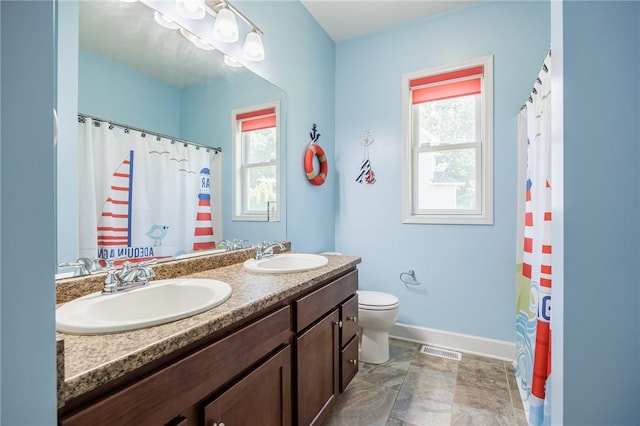 996 Summer Creek Ln, Webster, NY 14580 - full bathroom featuring plenty of natural light, double vanity, and curtained shower