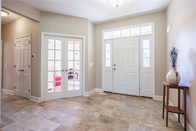 996 Summer Creek Ln, Webster, NY 14580 - entrance foyer with french doors and light stone finish flooring