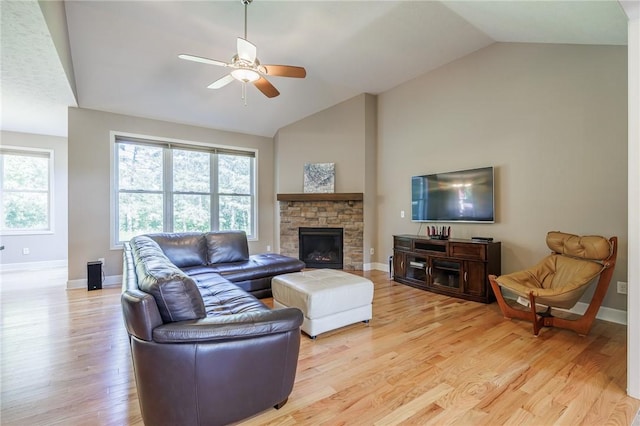 996 Summer Creek Ln, Webster, NY 14580 - living room with ceiling fan, light wood-style flooring, a fireplace, and high vaulted ceiling