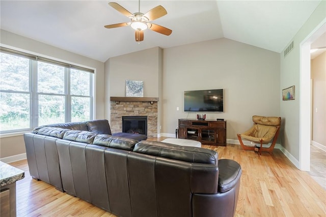 996 Summer Creek Ln, Webster, NY 14580 - living room with vaulted ceiling, a ceiling fan, light wood-style flooring, and a fireplace