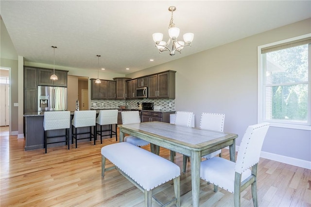 996 Summer Creek Ln, Webster, NY 14580 - dining space with light wood finished floors, a chandelier, and recessed lighting