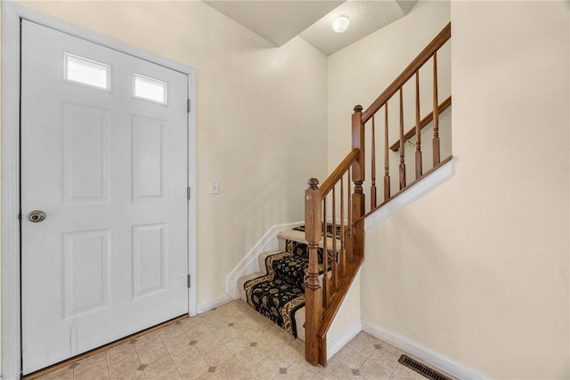 18 Butterfly Ln, Henrietta, NY 14586 - entrance foyer with stairway and light tile patterned floors