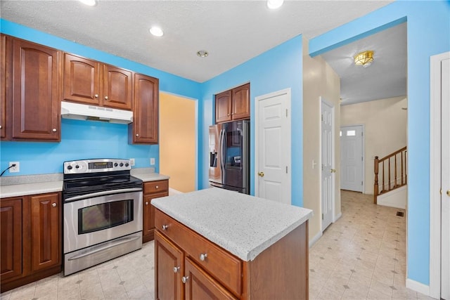 18 Butterfly Ln, Henrietta, NY 14586 - kitchen featuring stainless steel appliances, under cabinet range hood, light countertops, and recessed lighting